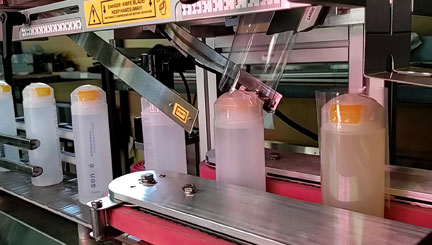 Pharmafill Shoulderless Bottle Bander automatically applies tamper-evident bands onto bottles without shoulders