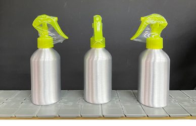 Tamper-Evident Neck Bander Automatically Applies Shrinkbands to Spray Bottles